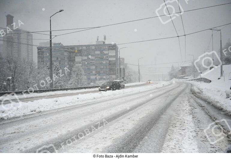Driving a car on snow in the city in winter. - download the photo ...