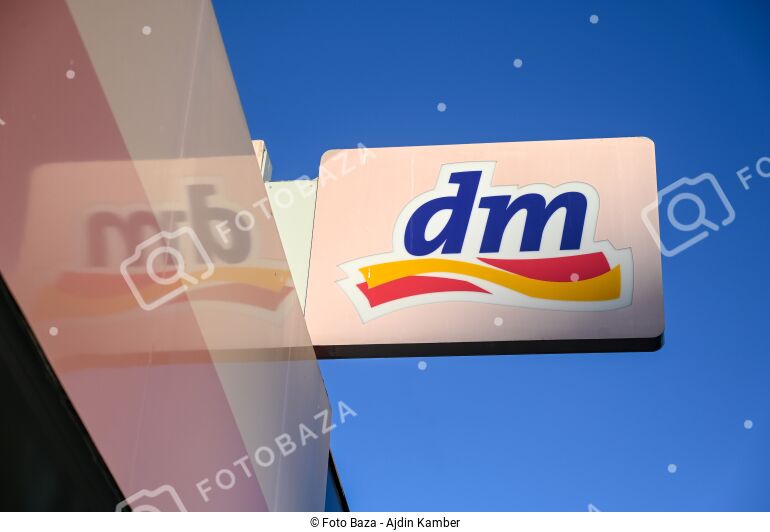Logo of DM shop. - download the photo | Foto Baza